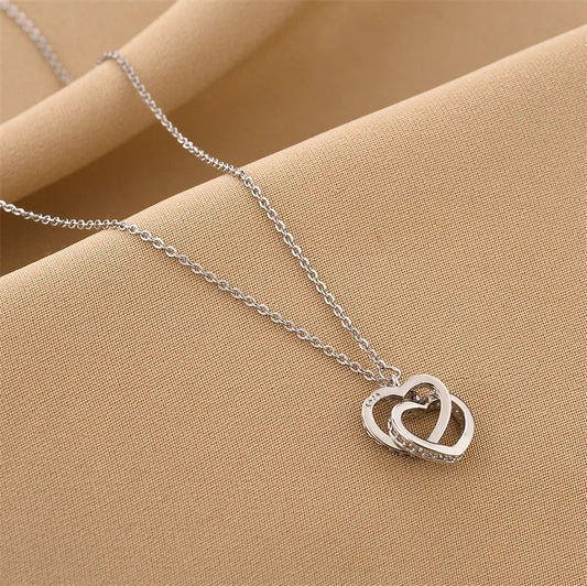 Ατσάλινο κολιέ χρώμα ασημί καρδιές ενωμένες (N1277) - necklace - charmy.gr