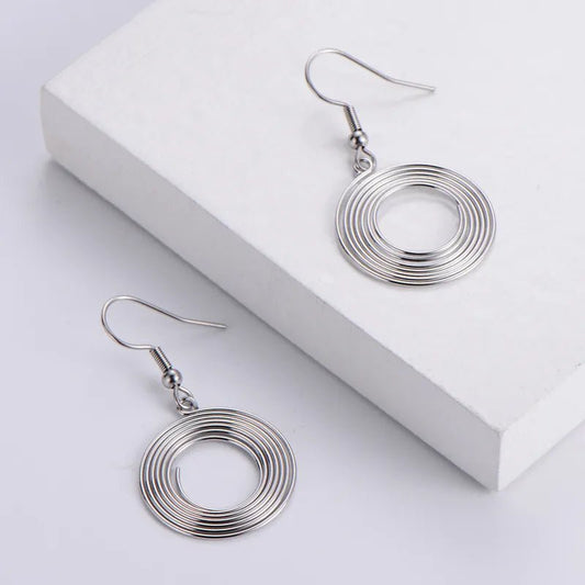 Γυναικείο ατσάλινα κρεμαστά σκουλαρίκια στριφογυριστά (E1146) - earrings  - charmy.gr