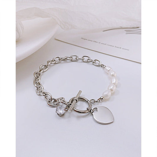 Γυναικεία ατσάλινη αλυσίδα χεριού καρδιά με μαργαριτάρια γλυκού νερού (B1263)  - bracelet - charmy.gr