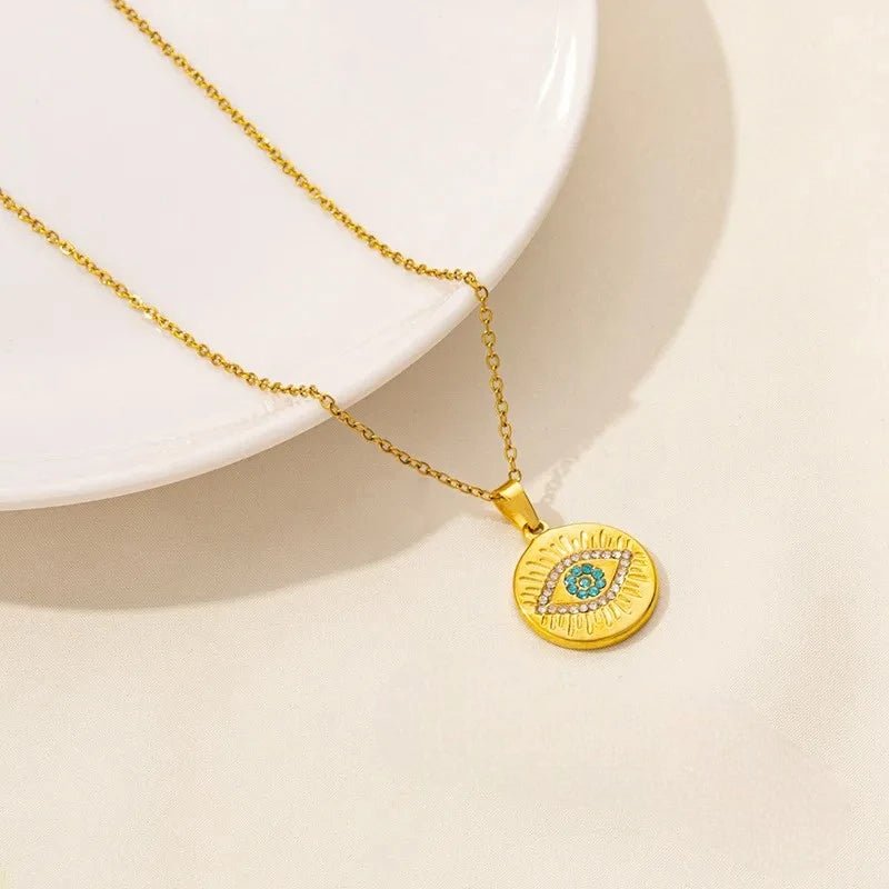 Ατσάλινο Χρυσό Κολιέ με Ματάκι και Ηλιαχτίδες (N1809) - charmy.gr